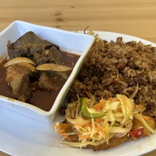 Tassot cabrit (fried goat in Haitian pois sauce, with rice and beans and fried plantains)