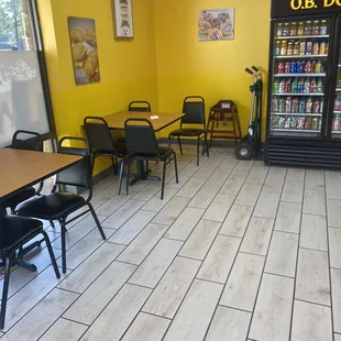 a dining area with tables and chairs