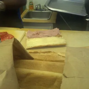 He takes great care when making his sandwiches