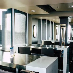 a view of a restaurant with tables and chairs