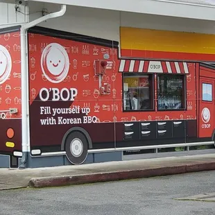 a food truck parked in front of a store