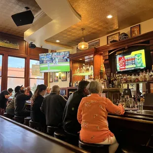 Interior with big screen televisions.