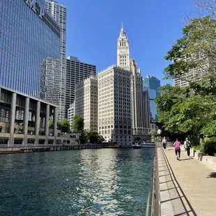 people walking along the river