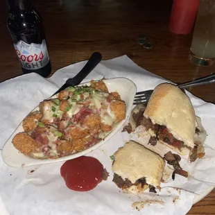 Philly cheesesteak and loaded tots.