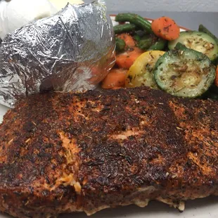 Blackened Grilled Salmon with Baked potatoes and sautéed vegetables