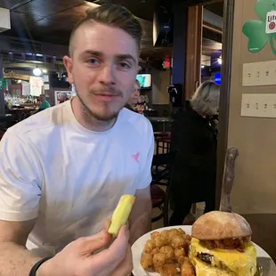 AJ with triple decker deliciousness. And he ate every bite. The eggnormous burger!