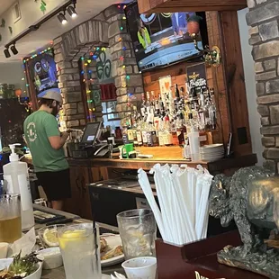 a bar with a stone wall