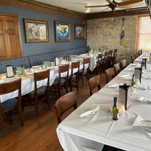 a long table with white tablecloths