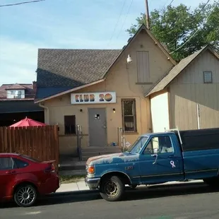 a blue truck and a red car
