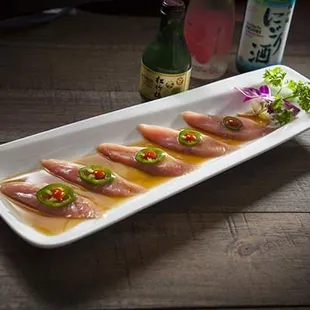Yellowtail Jalapeno Carpaccio]- Yellow tail, Jalapeño, Yuzu Sauce