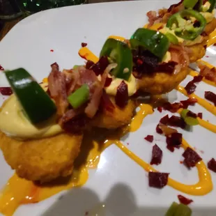 Deviled eggs, fried up with bacon and fresh jalapeños for topping