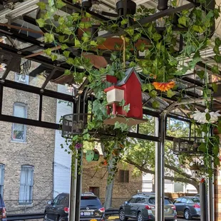 a birdhouse hanging from the ceiling
