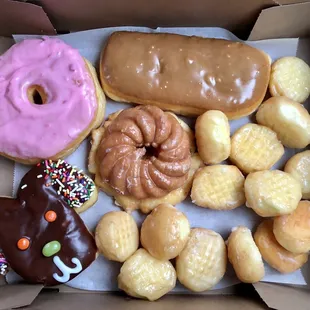 Four doughnuts and a dozen doughnut holes for about $10.