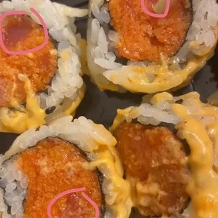 This is suppose to be a spicy tuna roll but as you can see it's mostly filled with panko I circled the spots that was tuna!!!