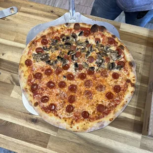 All pepperoni with mushrooms on half