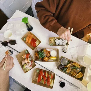 salmon/tuna sushi, california rolls, gyoza, honey sriracha chicken wings, rainbow roll &amp; tuna roll