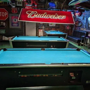 pool tables and neon signs