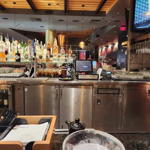 a bar with a television in the background