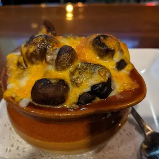 Mushrooms with white wine and cheese. Interesting but good.