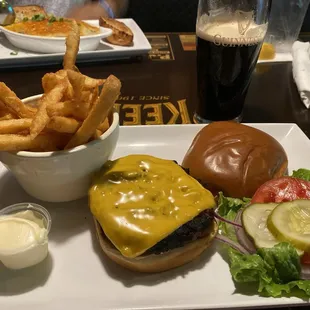 Cheeseburger in Paradise, fried and a Guinness.