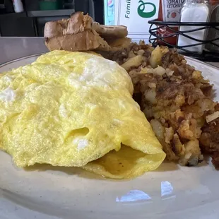 Three-meat omelet with breakfast potatoes and rye toast