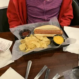 A proud hot dog owner
