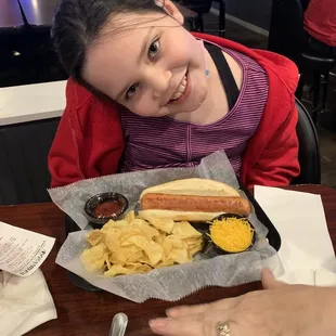 A kid and her hot-dog