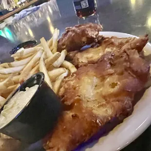 Fish and chips the first one was burnt but as soon as bartender saw it she said oh no way! And replaced it immediately - great service!!