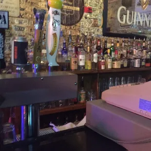 a bar with a variety of liquors