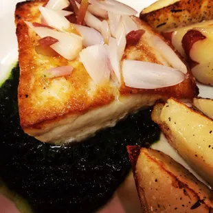 Seared Mahi Mahi with pickled wild ramps and ramp pesto - a seasonal specialty.