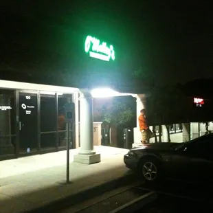 a car parked in front of the store