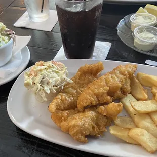 Fish and chips with a side of potato salad.