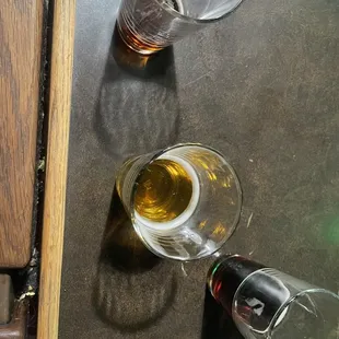 two glasses of beer on a table