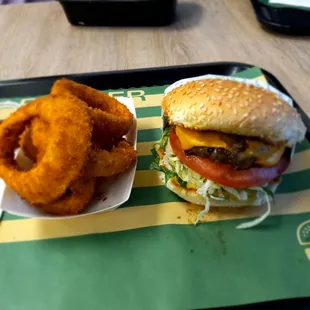 Single cheese burger and onion rings