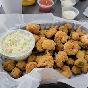 Shrimp basket with okra and potatoe salad and coleslaw.