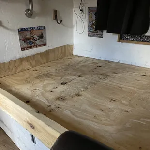 This is how you make a pedestal for a bed! Crappy work all the way around and I can't take pictures of the air conditioner or roof