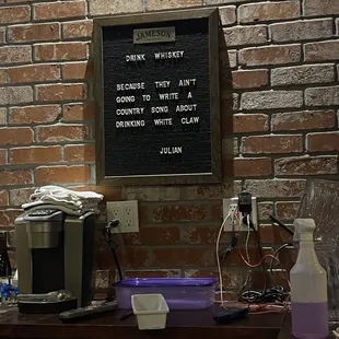 a sign on a brick wall