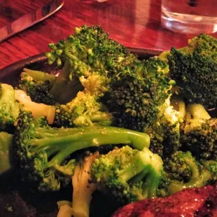 The side of broccoli was tasty but it could have been from the steak juices.