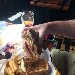 Club sandwich, super thick with crispy bacon and well seasoned French fries.