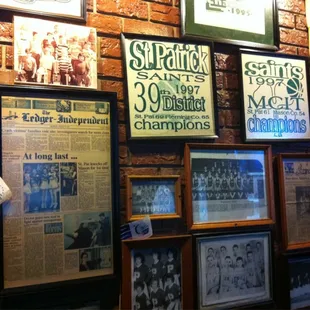 a wall full of framed sports memorabilia