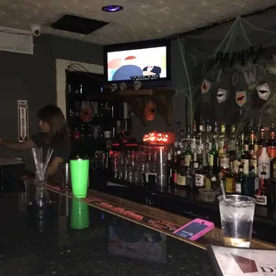 a man and a woman sitting at the bar