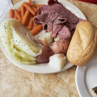 Corned beef , cabbage , carrots and red potatoes
