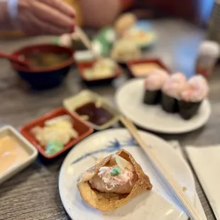 Put some crab salad, ginger, and wasabi inside my inari.