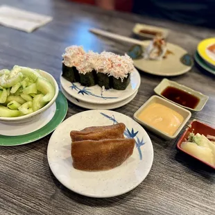 Inari, cucumber salad, and krab salad.