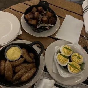 Crispy fingerling potatoes appetizer &amp; garlic saffron aioli. Deviled Eggs. Pork belly burnt ends with hot honey