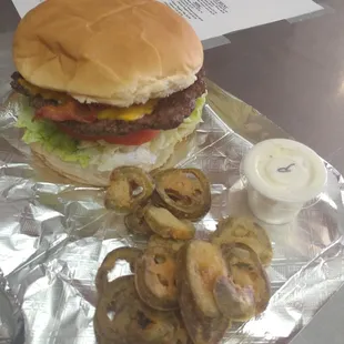 Homemade burgers with fried peppers and ranch