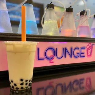 a drink in a plastic cup with a straw