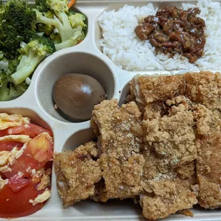 Chicken Cutlet Bento; fried chicken cutlets, broccoli, tomato egg, braised pork rice, and a marinated egg.