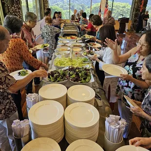 The buffet line starts with clean plates