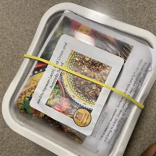 a plastic container filled with seeds